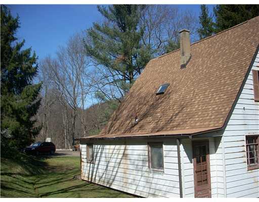 Exterior Front. New Room, steel siding needs sanded and painted or replaced!