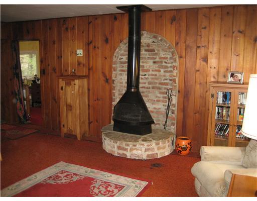 435 Cliff Road Baden, PA 15005 - Photo 14 of 17 Living Room. Knotty Pine walls and free standing fireplace