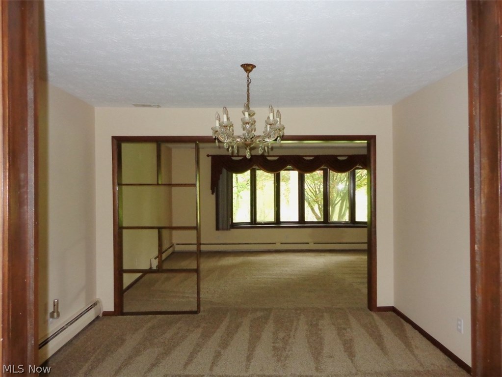 11167 Robson Road Grafton, OH 44044 - Photo 12 of 33 The Formal dining room is conveniently located between the kitchen and living room.