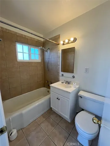 a bathroom with a sink a toilet and bathtub