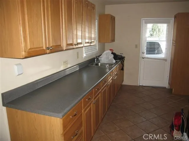 a kitchen with a sink stove and refrigerator
