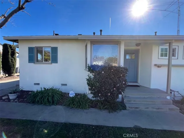 a view of a patio with table and chairs and potted plants