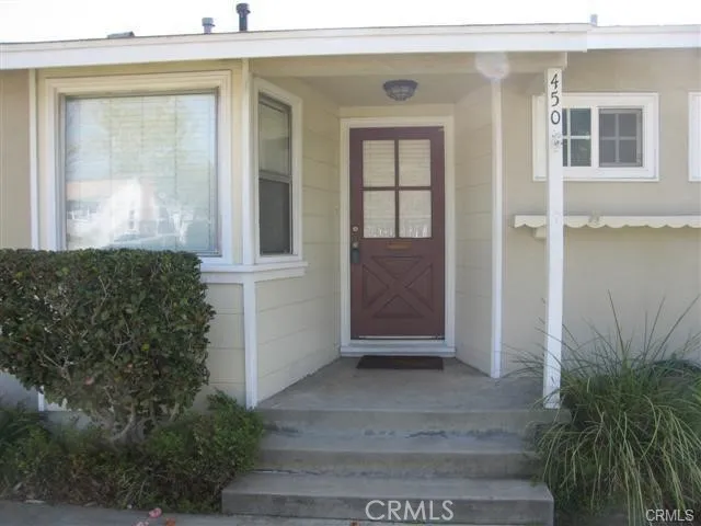 a view of front door and potted plants