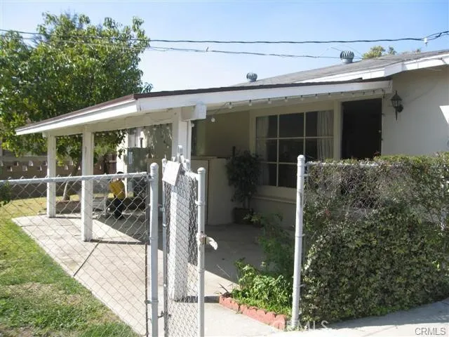 a view of a house with a backyard and balcony