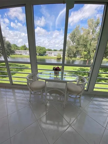 a view of a floor with a floor to ceiling window next to a yard