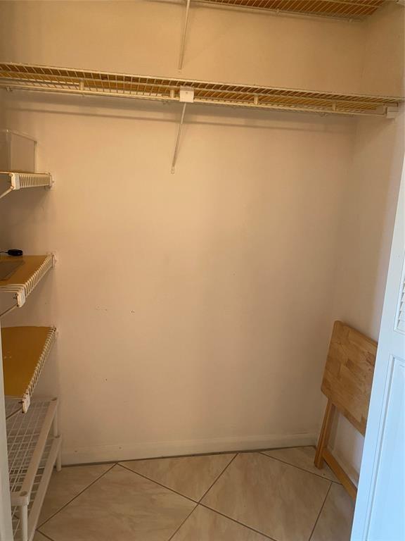 3012 Westbury F, Unit 3012 Deerfield Beach, FL 33442 - Photo 14 of 54 a view of a room with racks on the wall