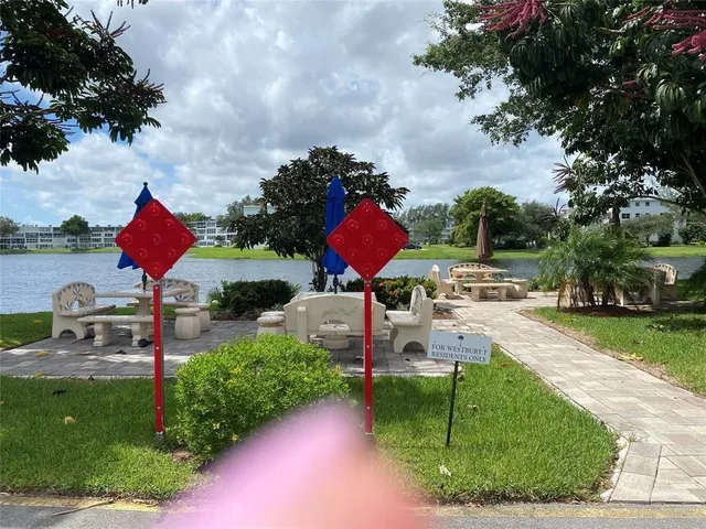 a view of a balcony with wooden floor