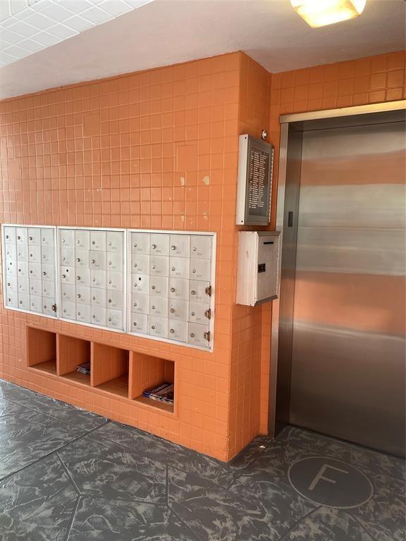 3012 Westbury F, Unit 3012 Deerfield Beach, FL 33442 - Photo 24 of 54 a view of a refrigerator in kitchen