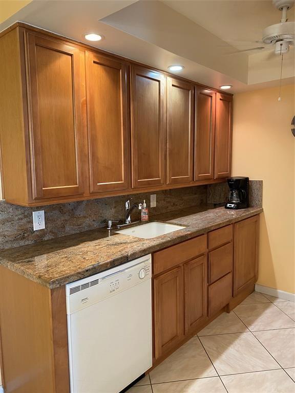 3012 Westbury F, Unit 3012 Deerfield Beach, FL 33442 - Photo 3 of 54 a kitchen with a sink and cabinets