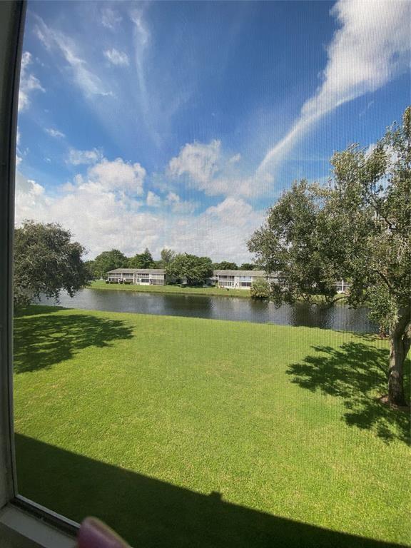 3012 Westbury F, Unit 3012 Deerfield Beach, FL 33442 - Photo 33 of 54 a view of a lake with a city