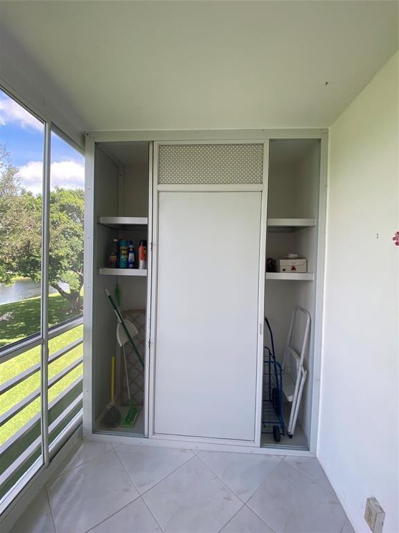 3012 Westbury F, Unit 3012 Deerfield Beach, FL 33442 - Photo 5 of 54 a view of a storage & utility room