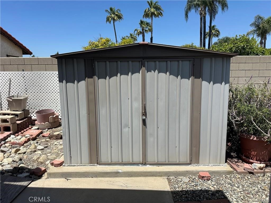 2598 Ayala Drive, Unit 34 Rialto, CA 92377 - Photo 5 of 13 a view of a wooden door with a house