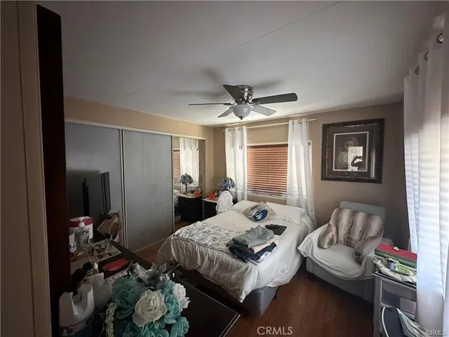 a bedroom with furniture and a window