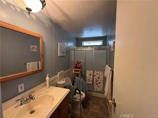 a bathroom with a sink and mirror