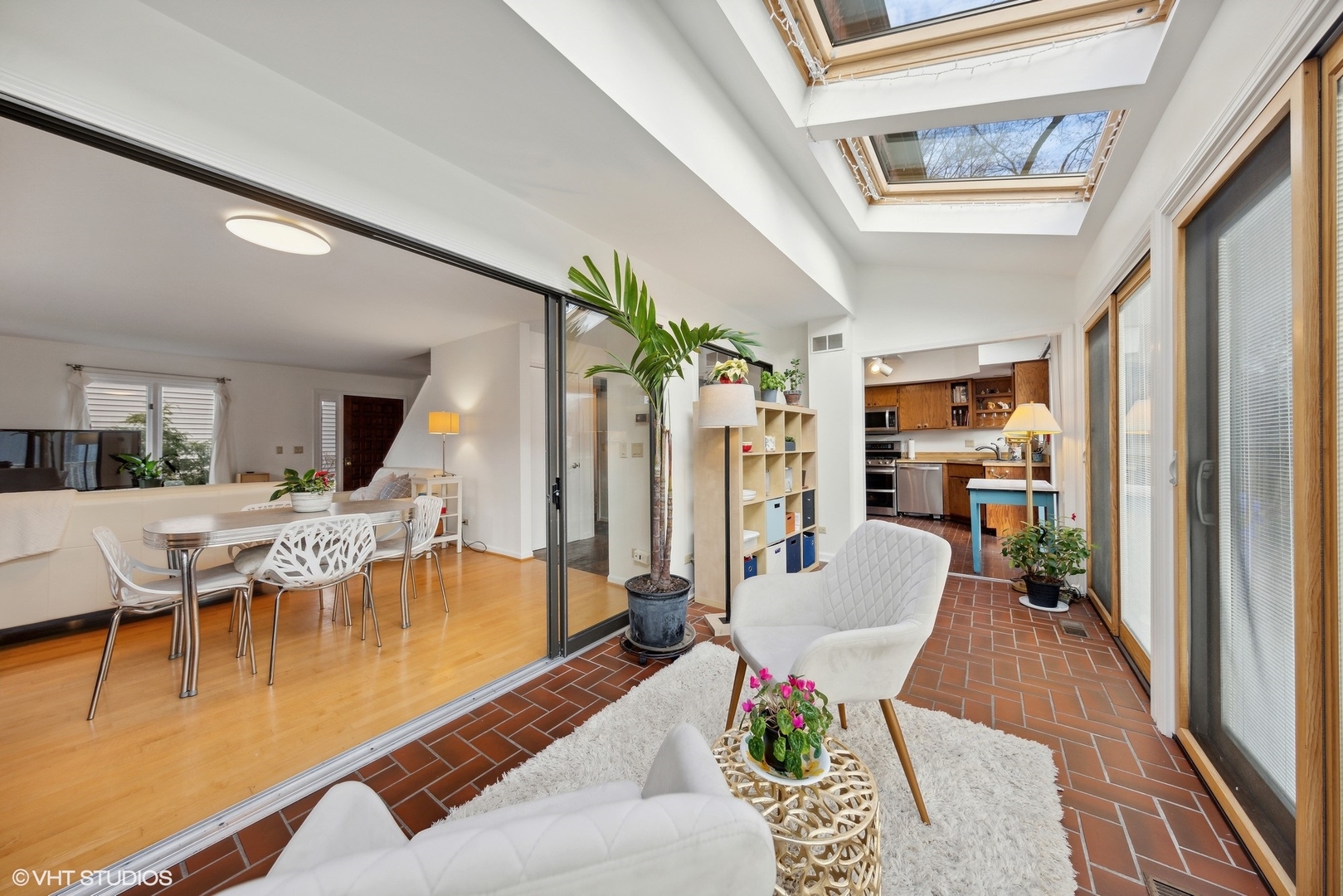 1908 Cherry Street Wheaton, IL 60187 - Photo 11 of 36 a living room with furniture dining table and a large window