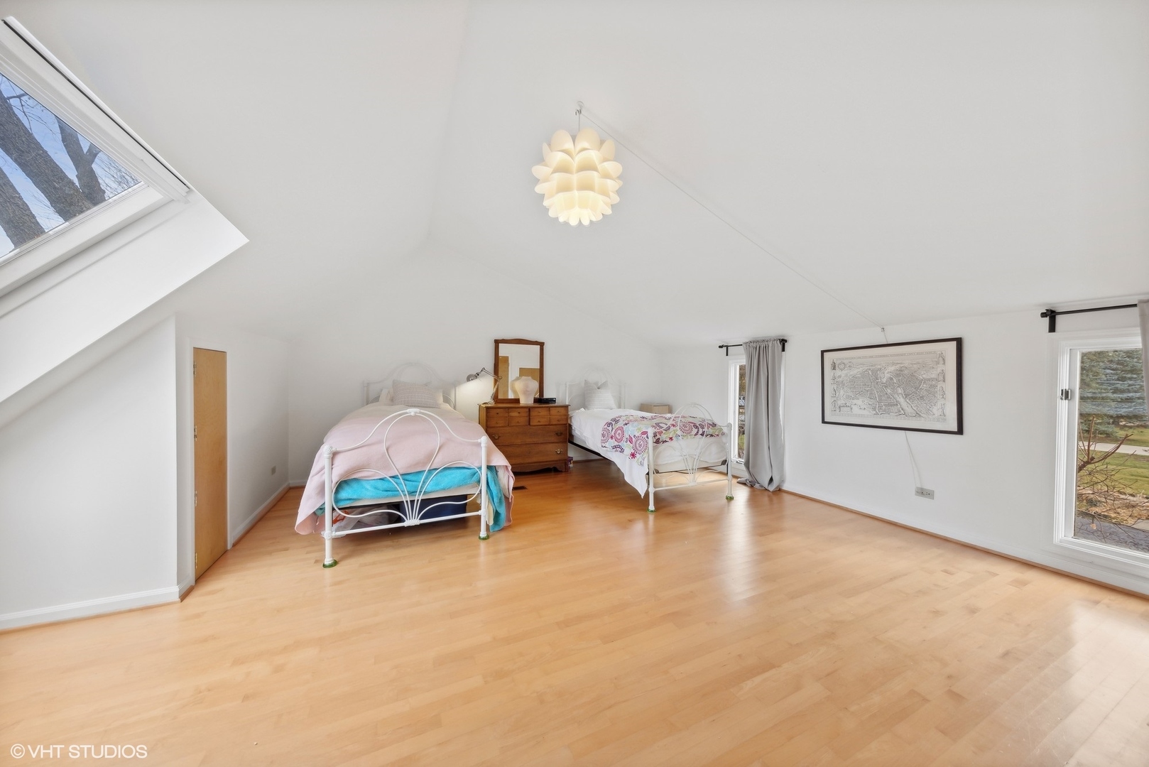 1908 Cherry Street Wheaton, IL 60187 - Photo 19 of 36 a bedroom with a bed and a chandelier
