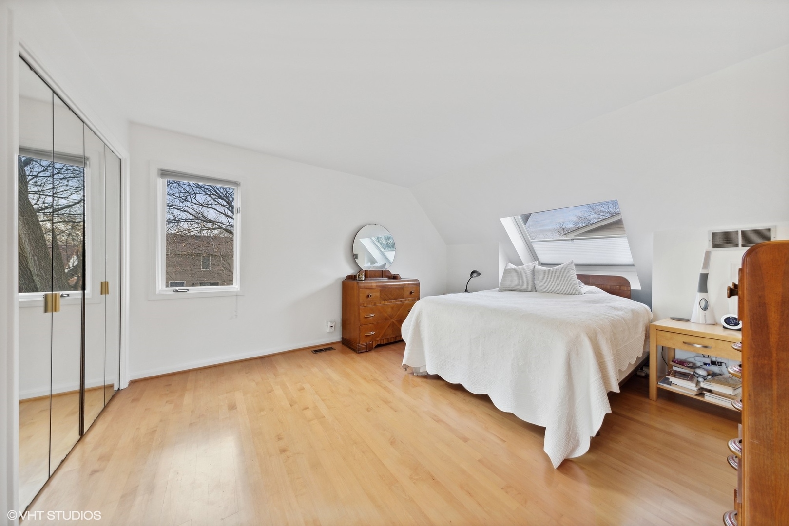 1908 Cherry Street Wheaton, IL 60187 - Photo 22 of 36 a spacious bedroom with a bed and wooden floor