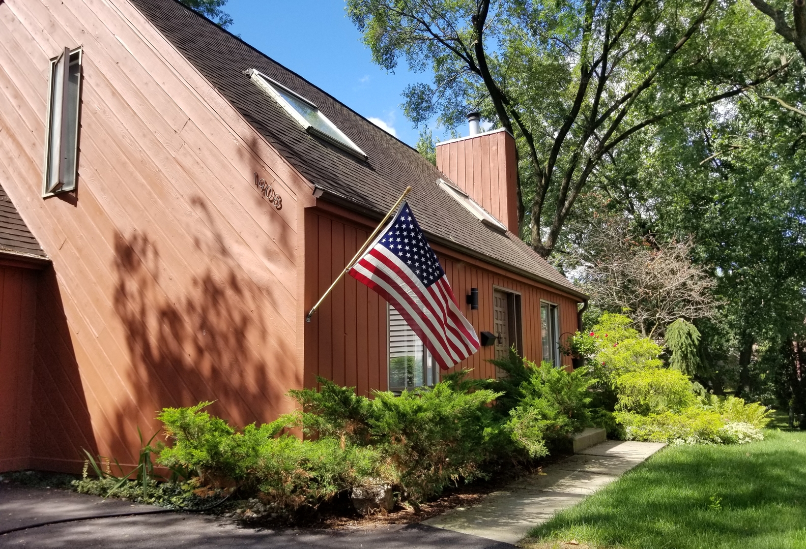 1908 Cherry Street Wheaton, IL 60187 - Photo 35 of 36 a front view of a house with plants and trees