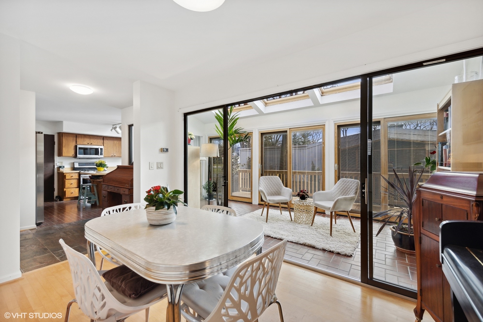1908 Cherry Street Wheaton, IL 60187 - Photo 8 of 36 a view of a dining room with furniture large windows and wooden floor