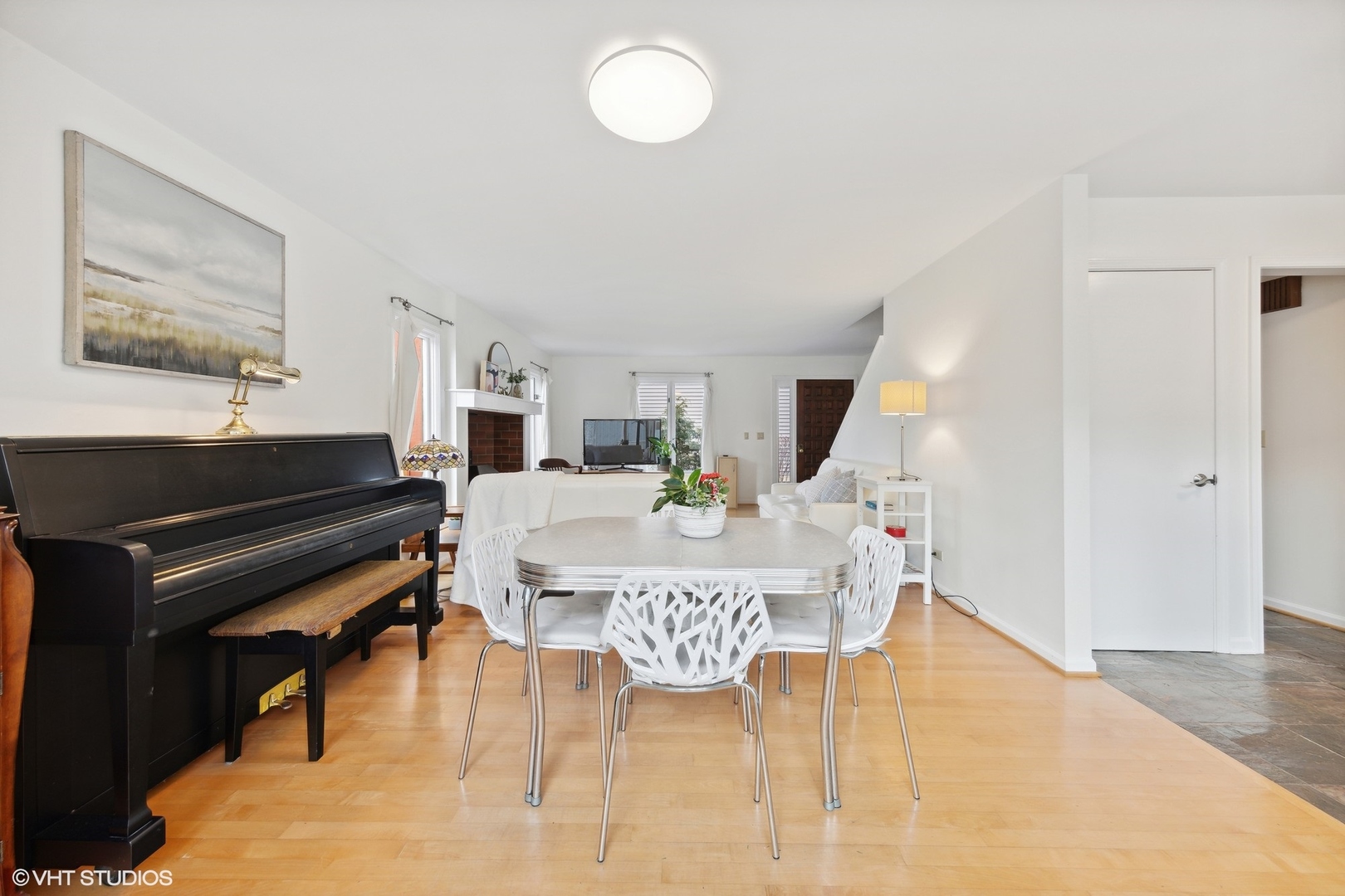 1908 Cherry Street Wheaton, IL 60187 - Photo 9 of 36 a living room with a piano and a dining table