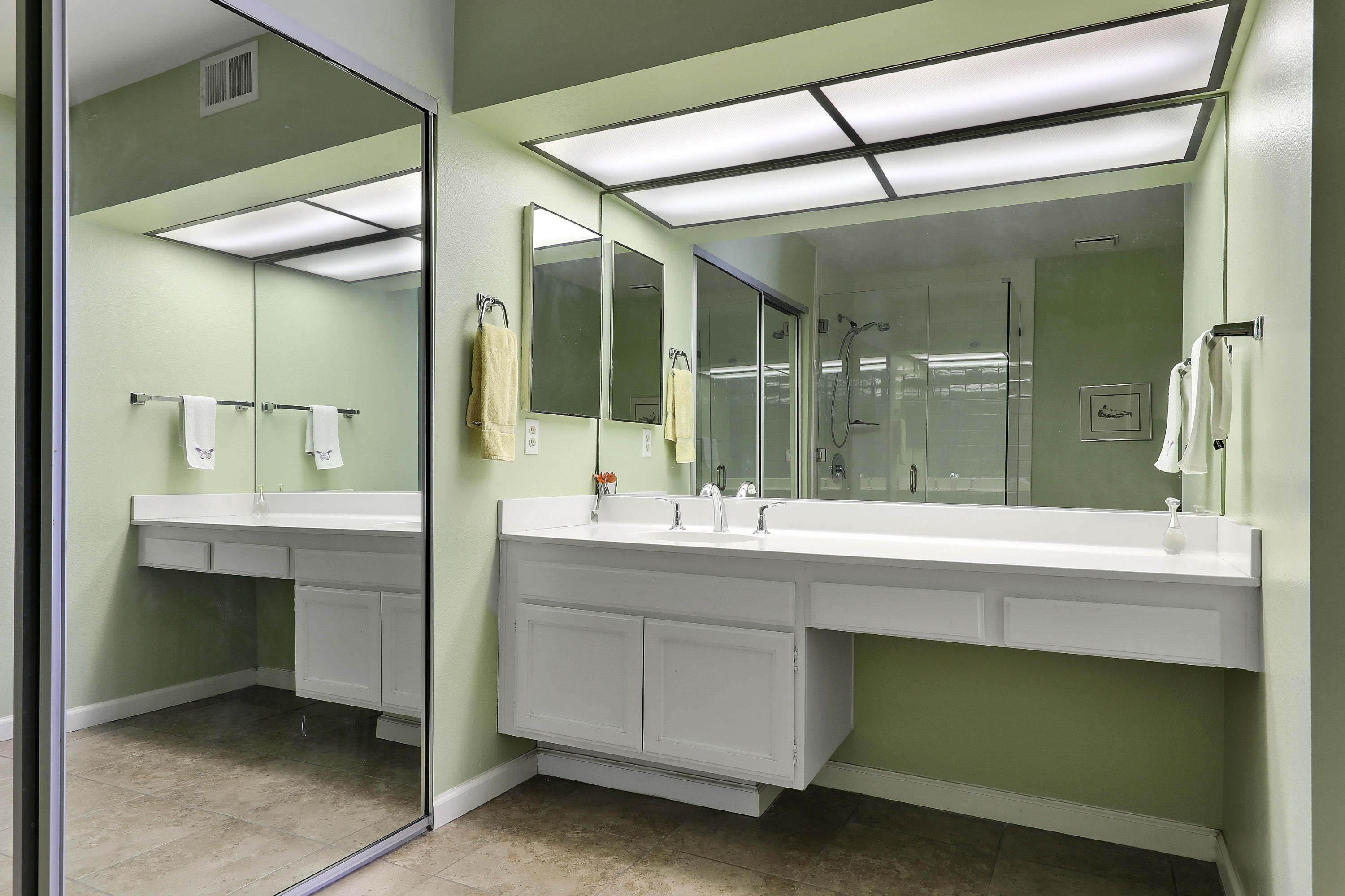 4 Leon Way Rancho Mirage, CA 92270 - Photo 11 of 20 a bathroom with a sink and mirror