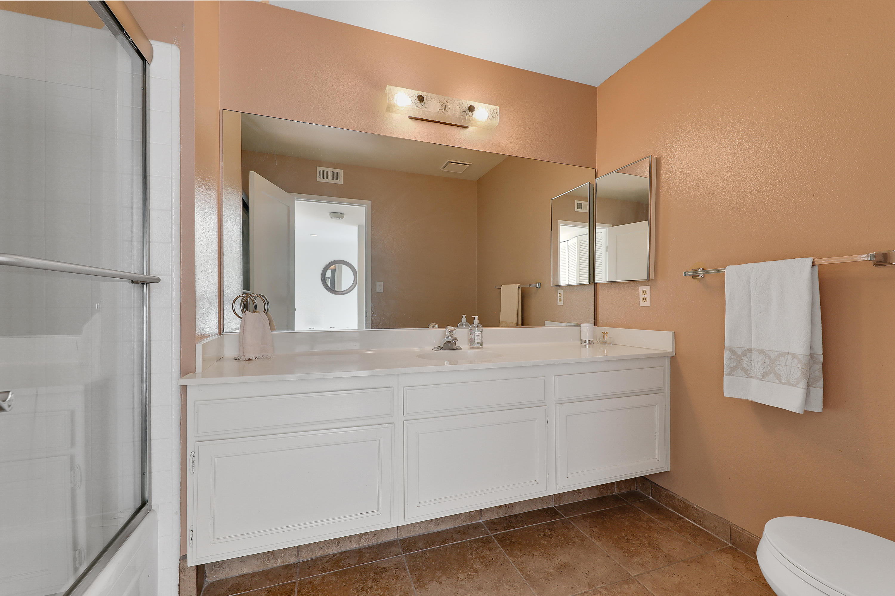 4 Leon Way Rancho Mirage, CA 92270 - Photo 14 of 20 a bathroom with a double vanity sink and a mirror