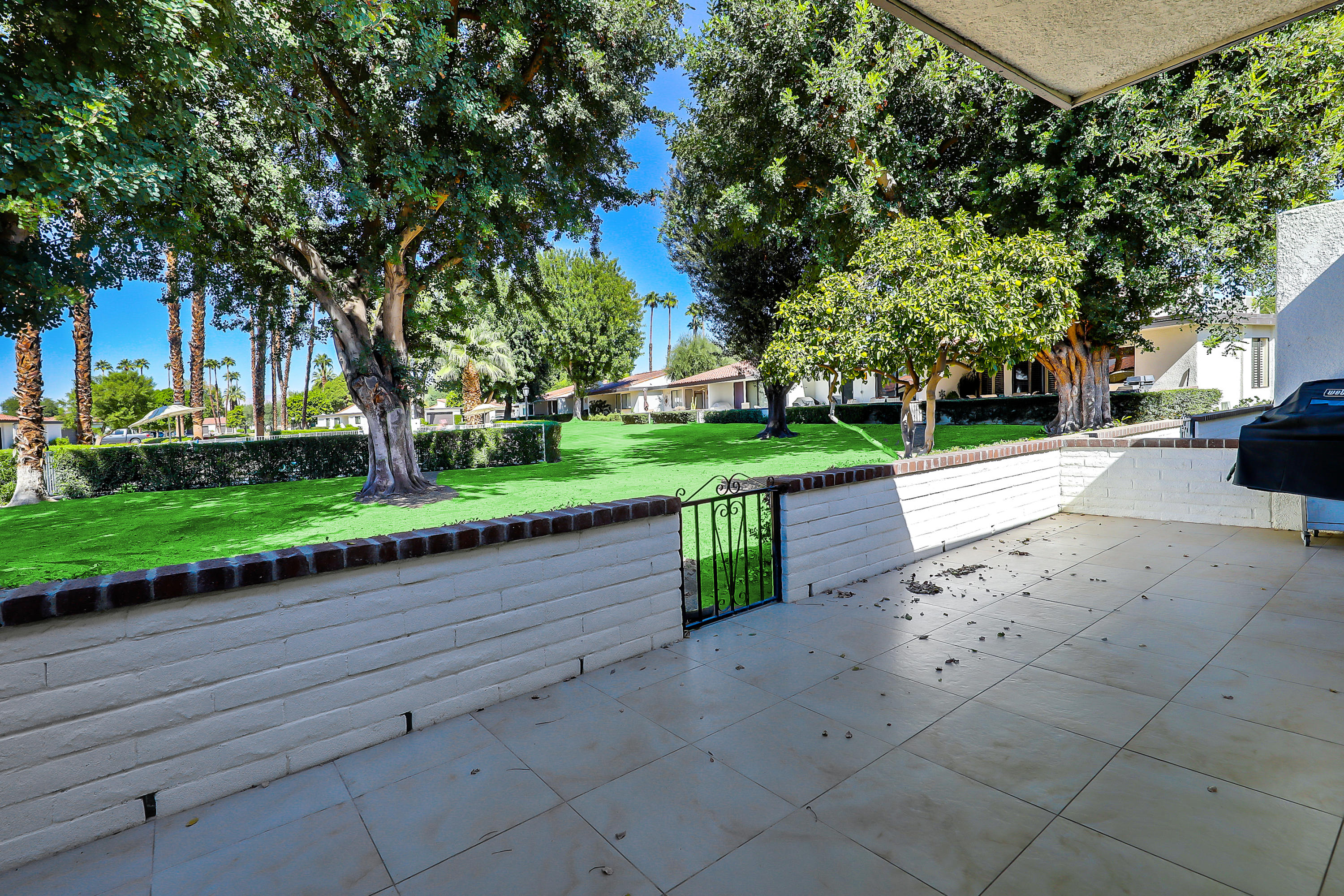 4 Leon Way Rancho Mirage, CA 92270 - Photo 15 of 20 a street view with a garden