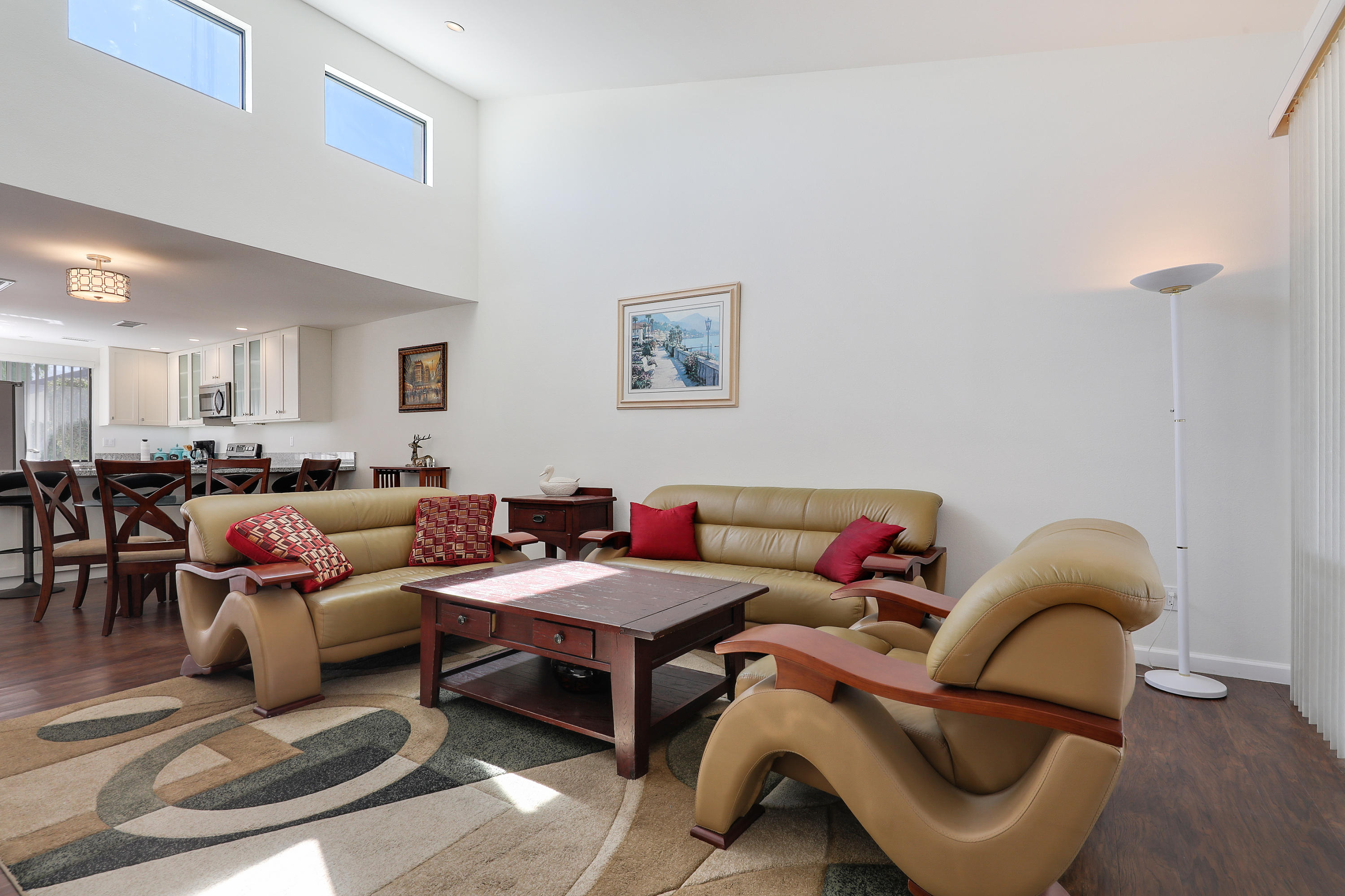 4 Leon Way Rancho Mirage, CA 92270 - Photo 6 of 20 a living room with furniture a rug and a window