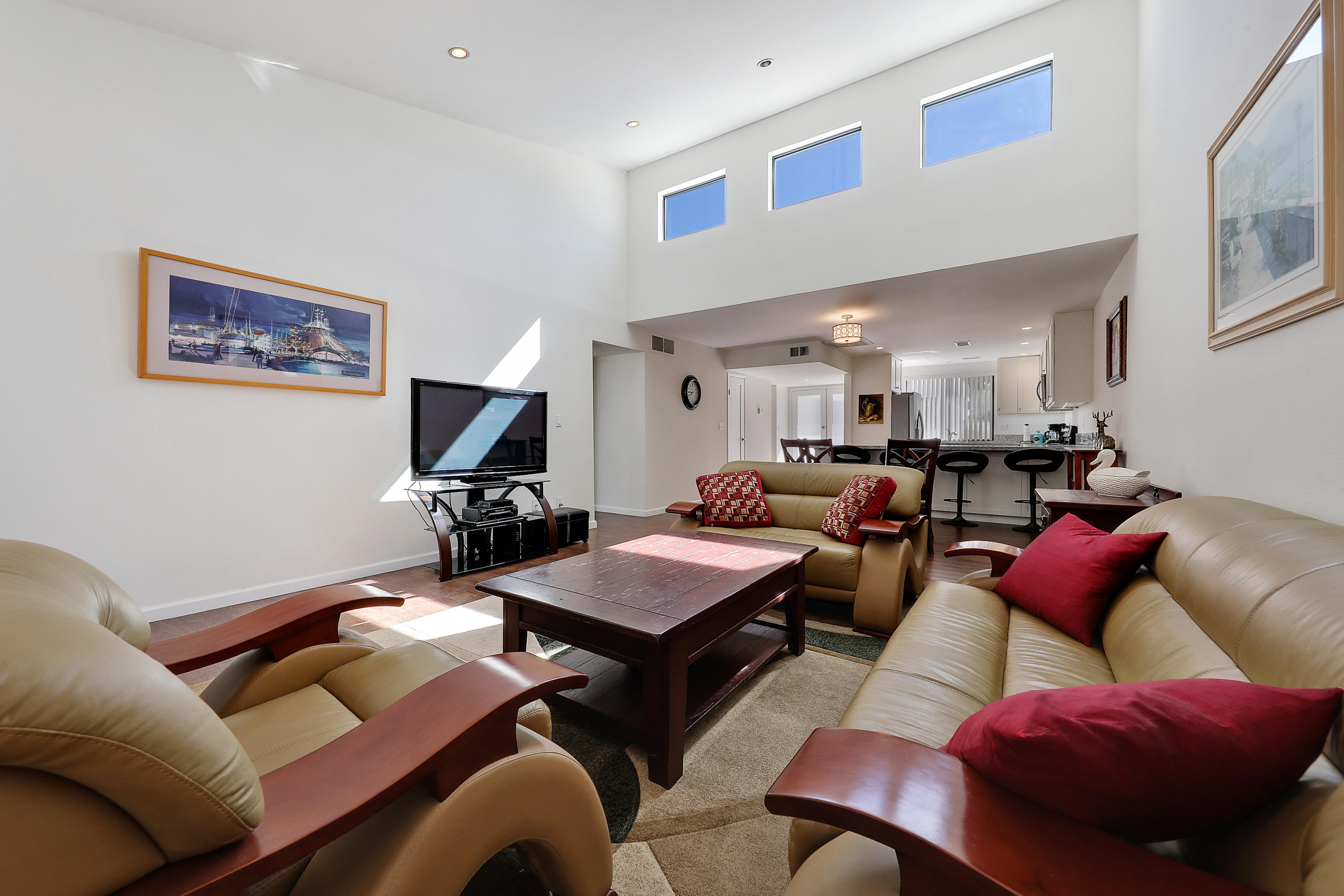 4 Leon Way Rancho Mirage, CA 92270 - Photo 7 of 20 a living room with furniture a rug and a projector