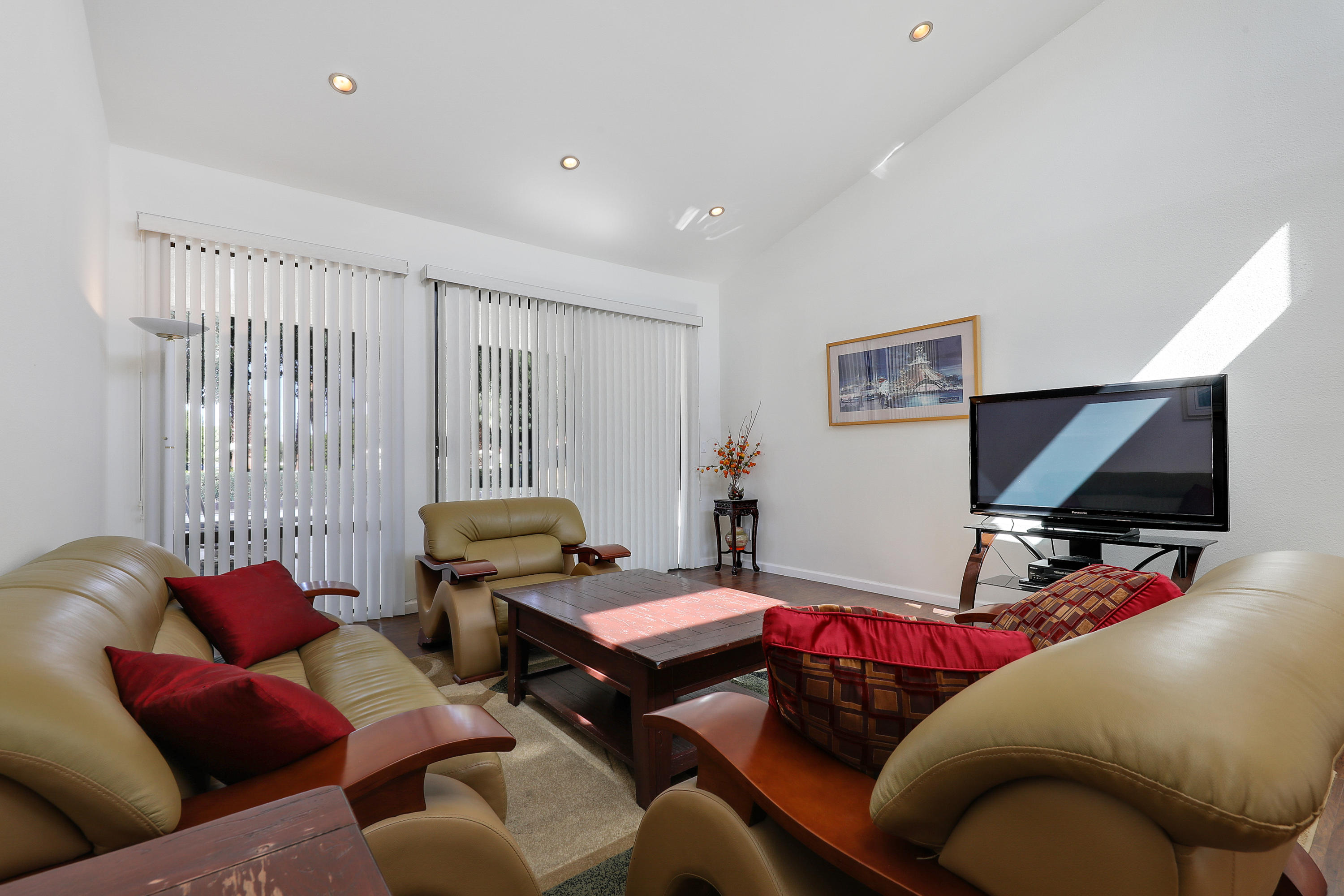 4 Leon Way Rancho Mirage, CA 92270 - Photo 9 of 20 a living room with furniture and a flat screen tv