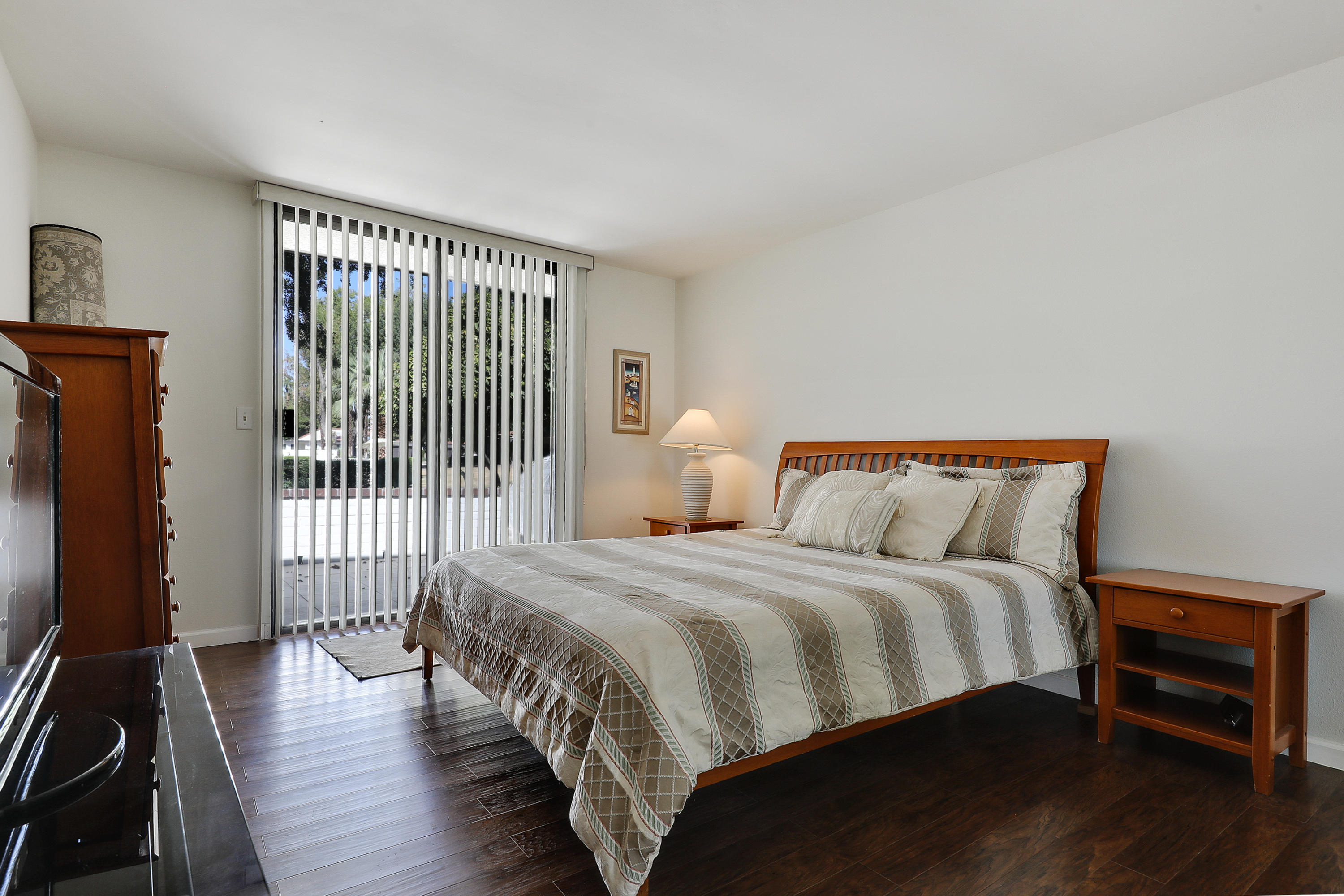 4 Leon Way Rancho Mirage, CA 92270 - Photo 10 of 20 a bedroom with bed and wooden floor