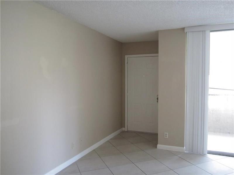 751 Lyons Road, Unit 18102 Coconut Creek, FL 33063 - Photo 3 of 9 a view of an empty room