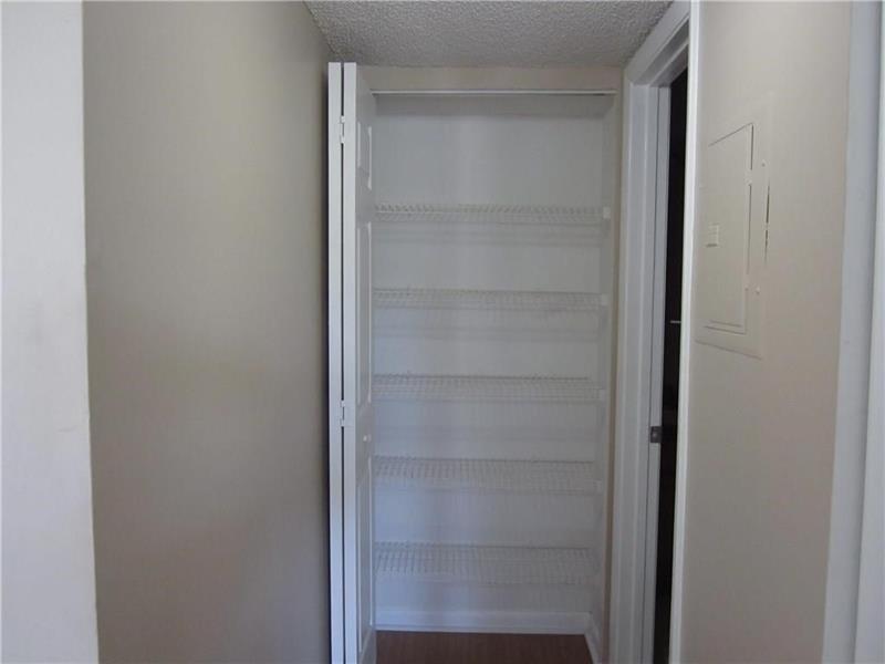 751 Lyons Road, Unit 18102 Coconut Creek, FL 33063 - Photo 5 of 9 a view of walk in closet with empty racks