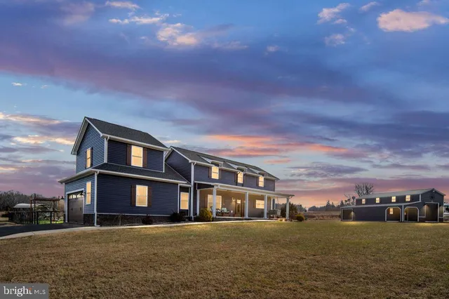 a living room with furniture flat screen tv and a fireplace