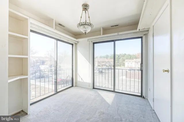 a view of a room with windows