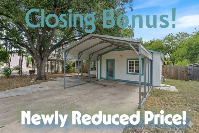 a view of a white house with a sign broad
