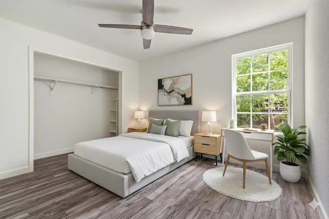 a bedroom with a bed and a table