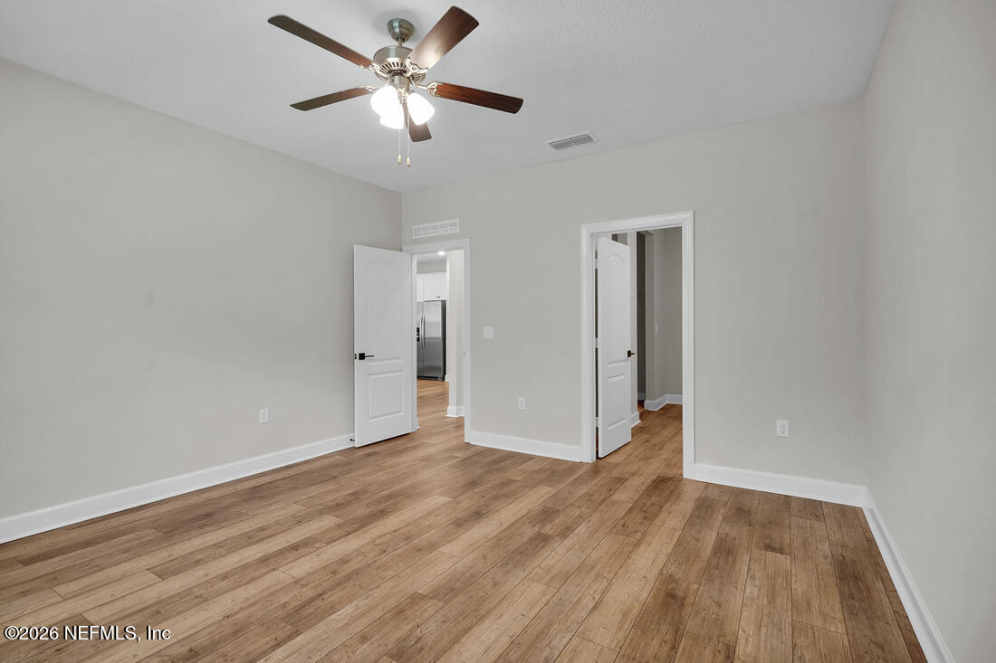6970 Canoe Birch Road Jacksonville, FL 32219 - Photo 13 of 20 wooden floor in an empty room