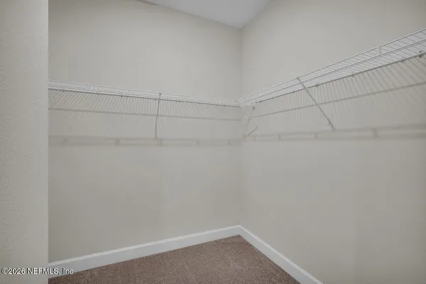 a view of a room with racks on the wall