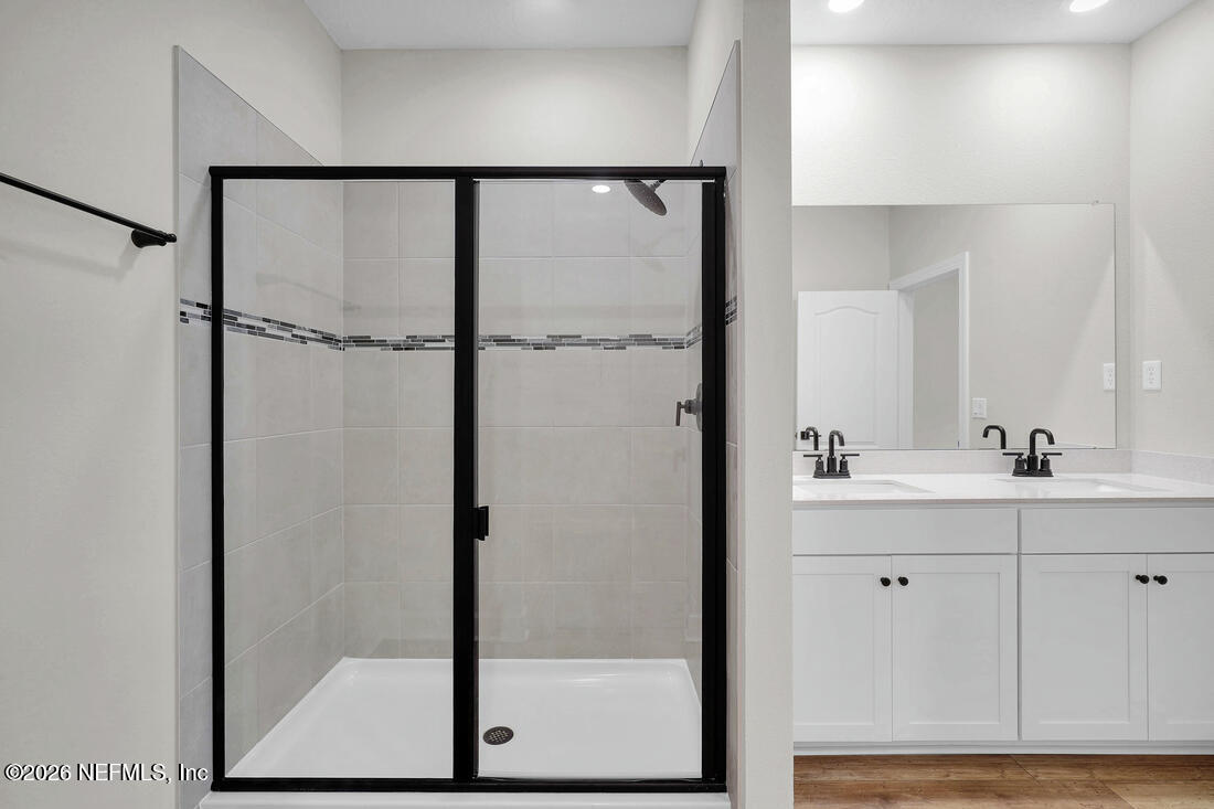 6970 Canoe Birch Road Jacksonville, FL 32219 - Photo 16 of 20 a bathroom with a shower and a sink