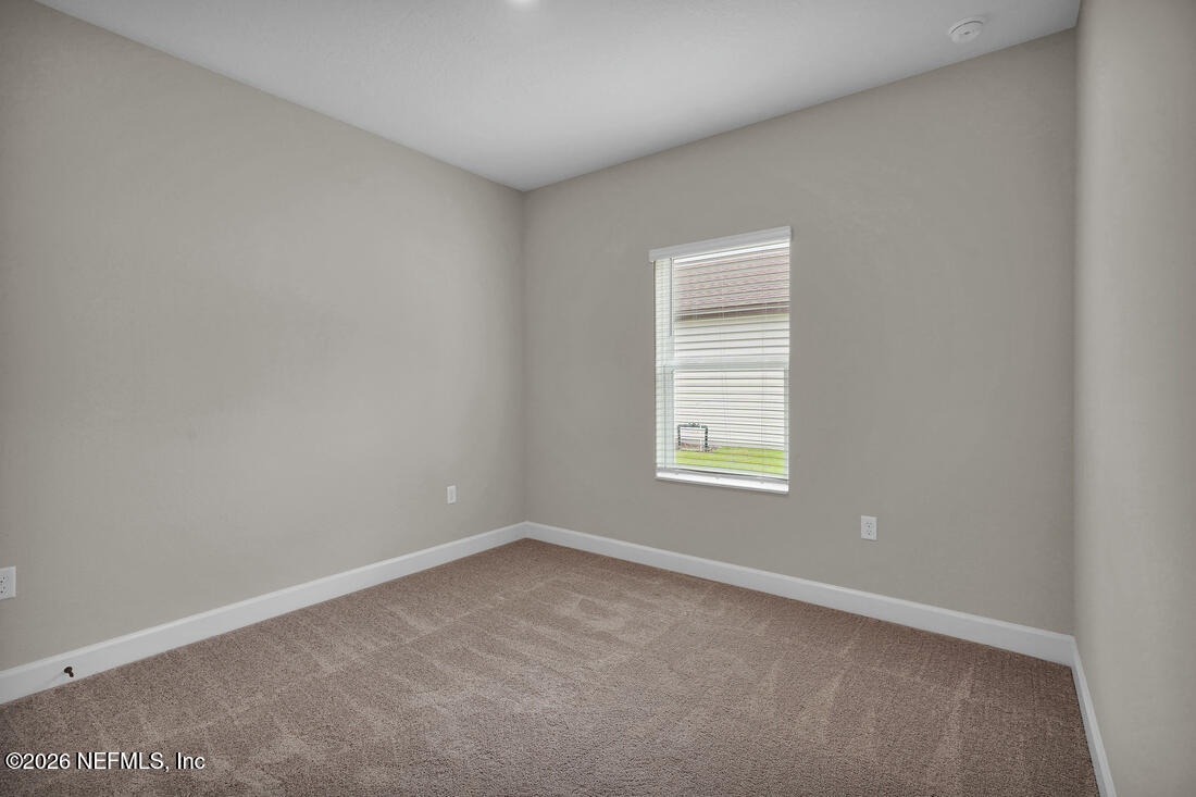 6970 Canoe Birch Road Jacksonville, FL 32219 - Photo 19 of 20 an empty room with a window