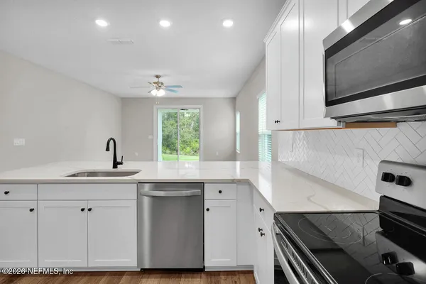 a kitchen with a sink and cabinets