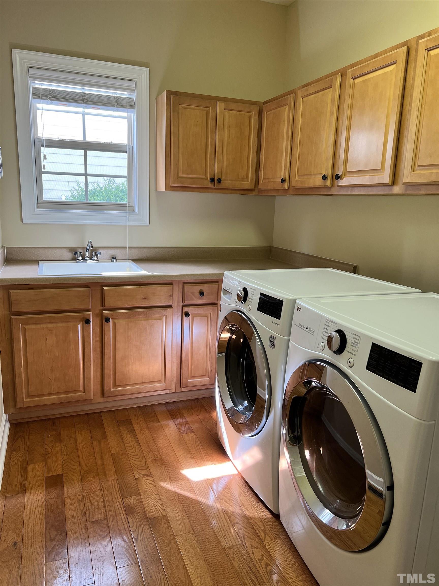 309 Parish House Road Cary, NC 27513 - Photo 11 of 33 a utility room with sink dryer and washer
