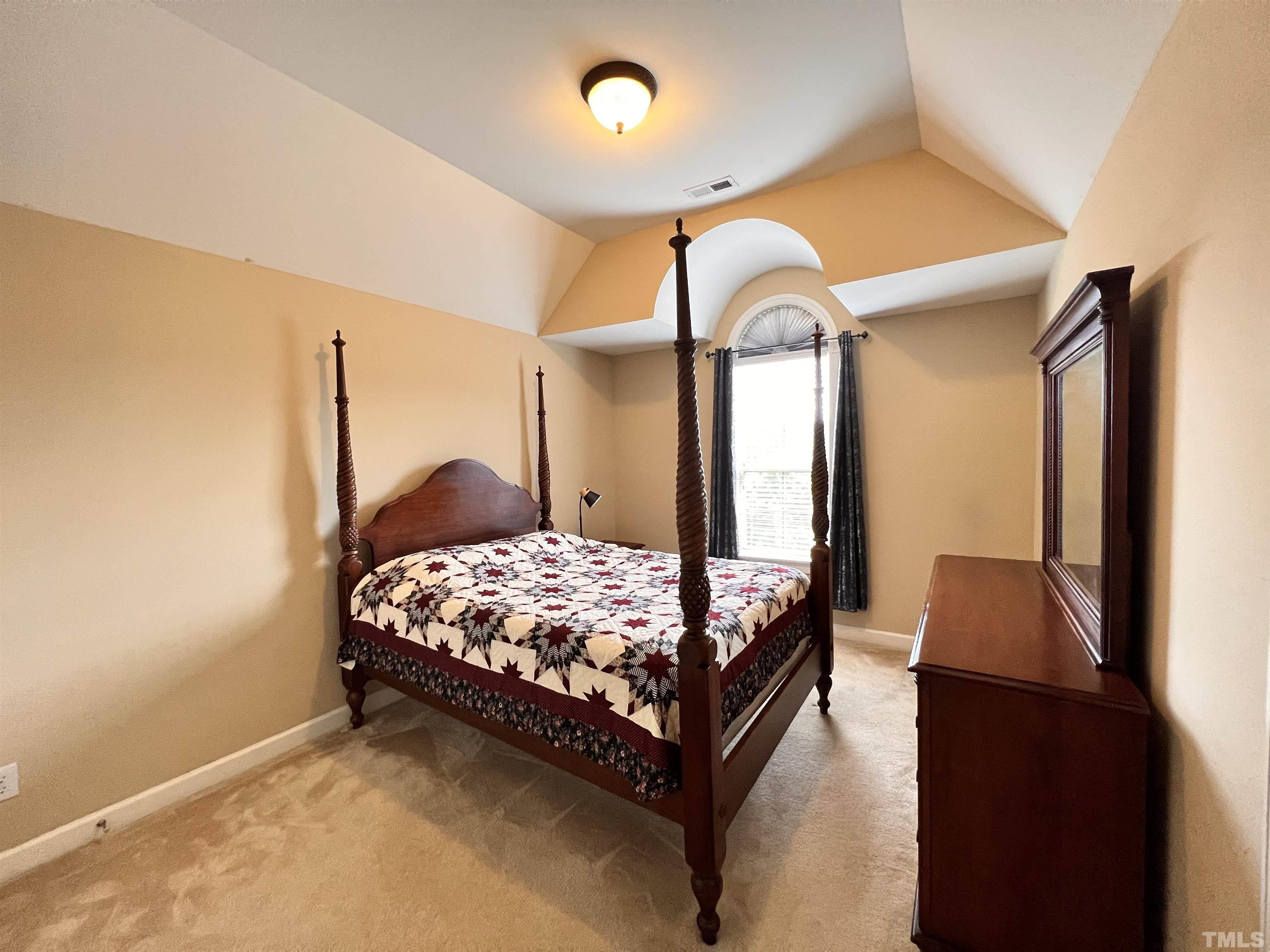 309 Parish House Road Cary, NC 27513 - Photo 13 of 33 a bedroom with a bed mirror and window
