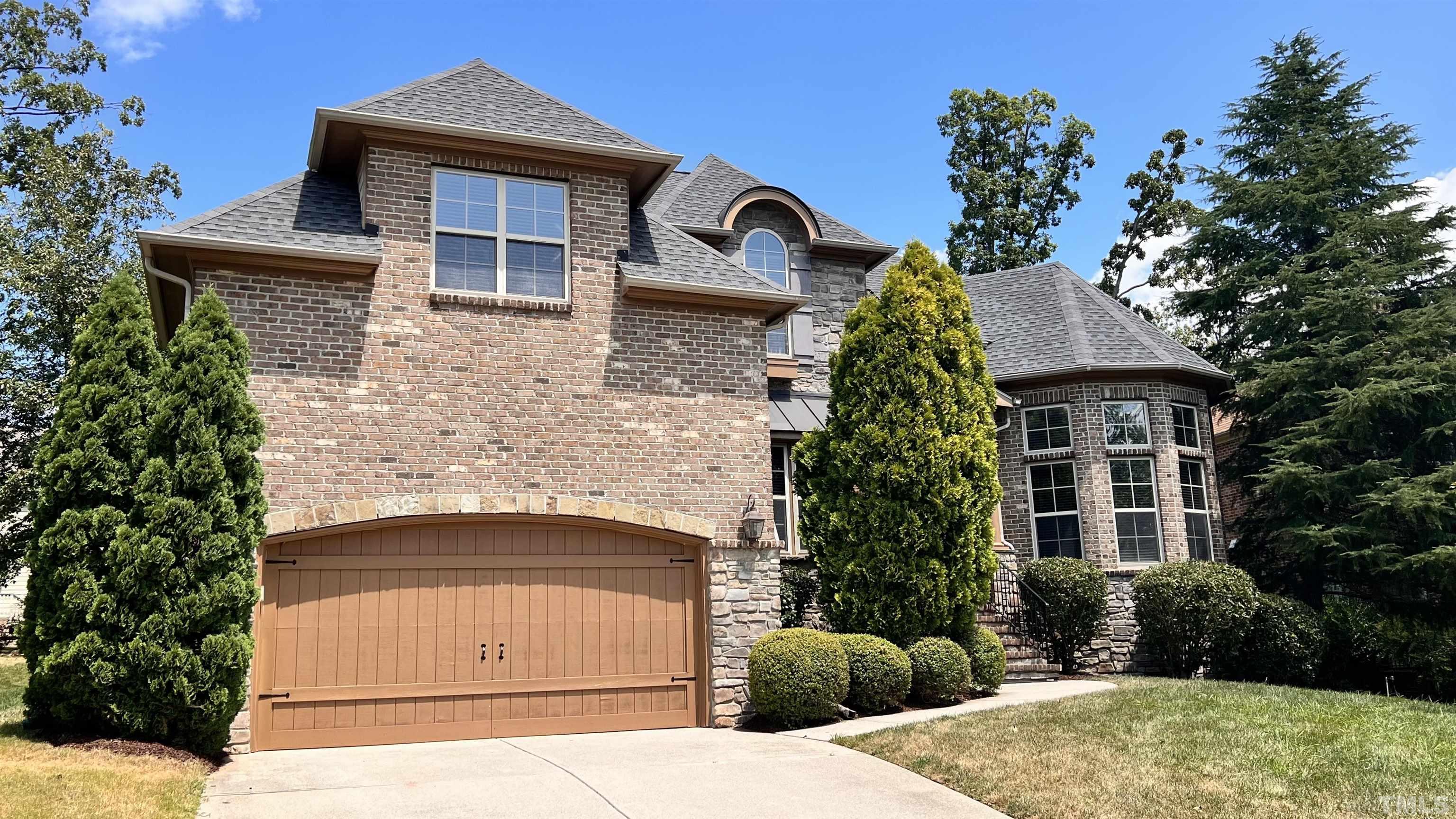 309 Parish House Road Cary, NC 27513 - Photo 2 of 33 a front view of a house with a yard