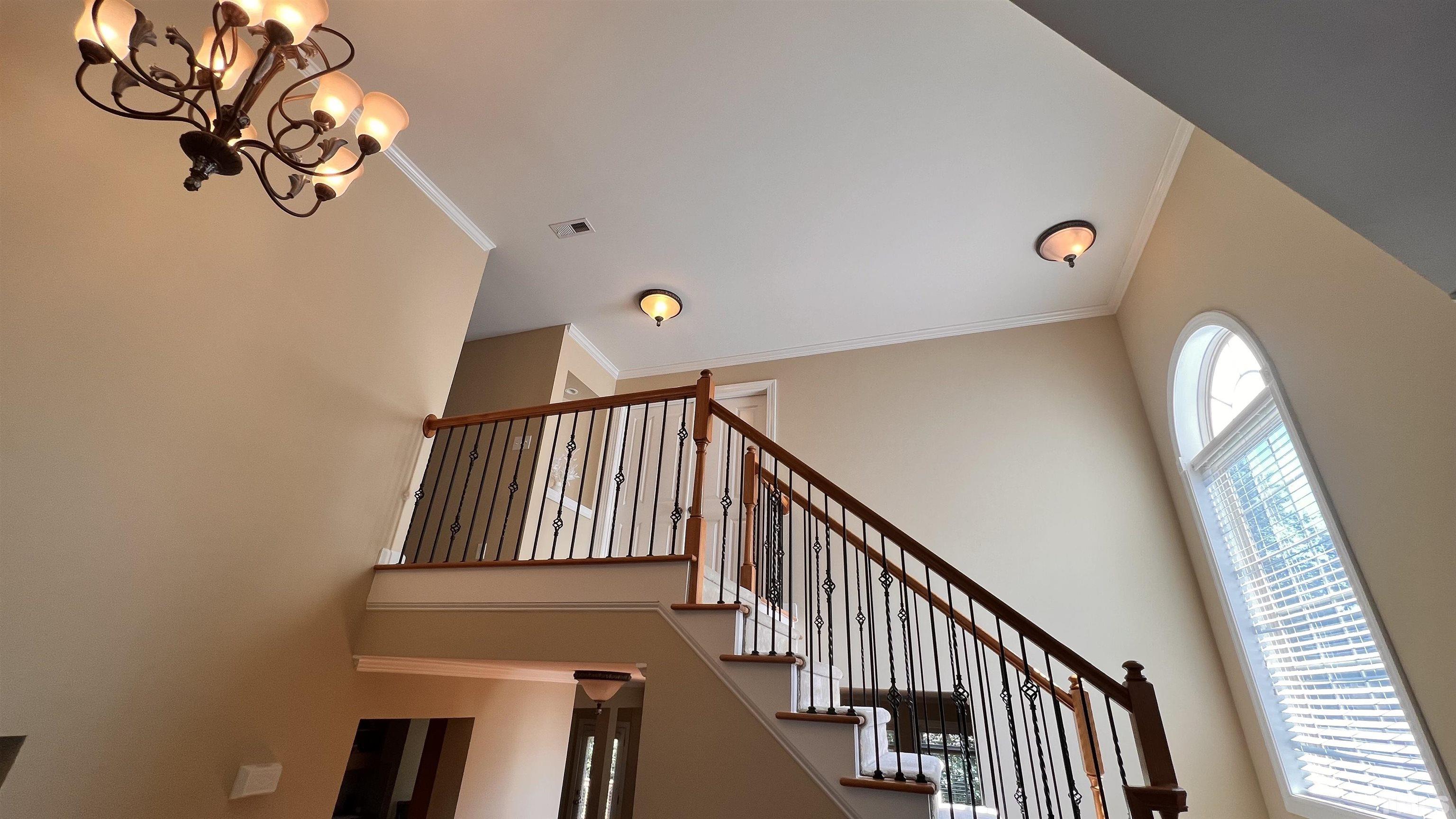 309 Parish House Road Cary, NC 27513 - Photo 21 of 33 a view of staircase with railing and white walls