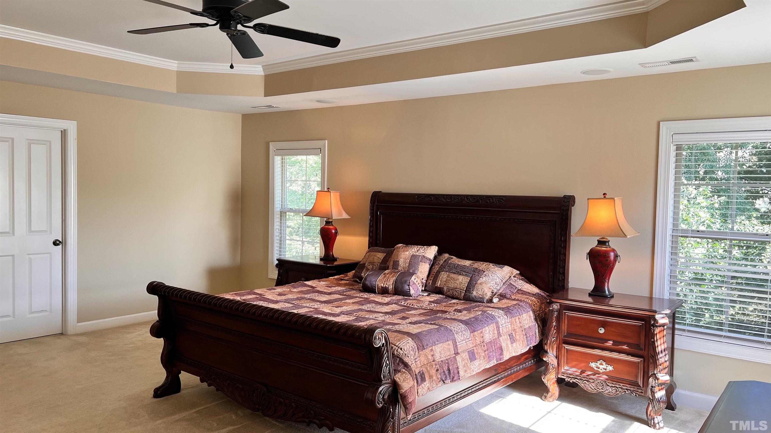 309 Parish House Road Cary, NC 27513 - Photo 23 of 33 a bedroom with a bed and wooden floor