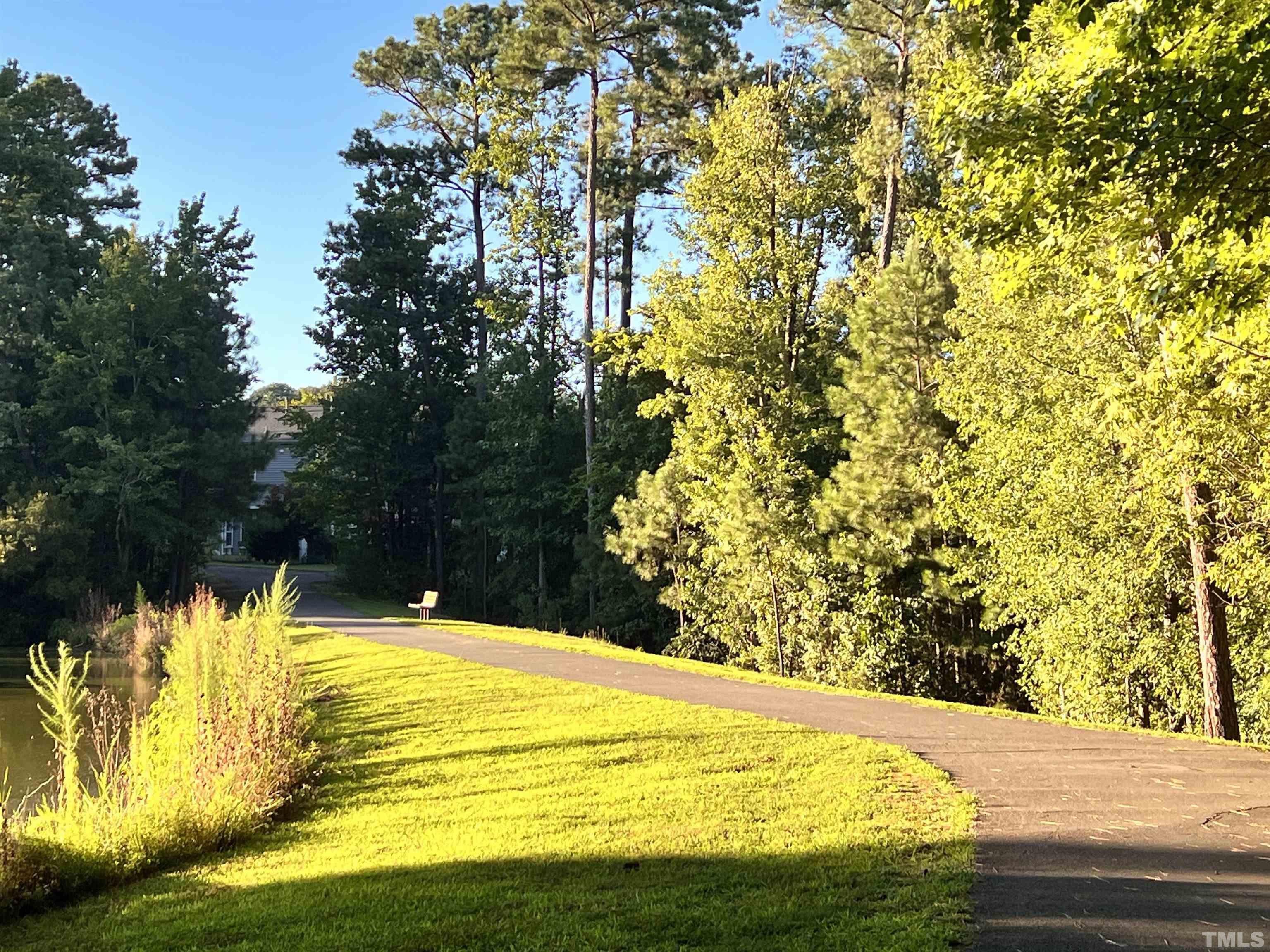 309 Parish House Road Cary, NC 27513 - Photo 32 of 33 a swimming pool with trees in the background