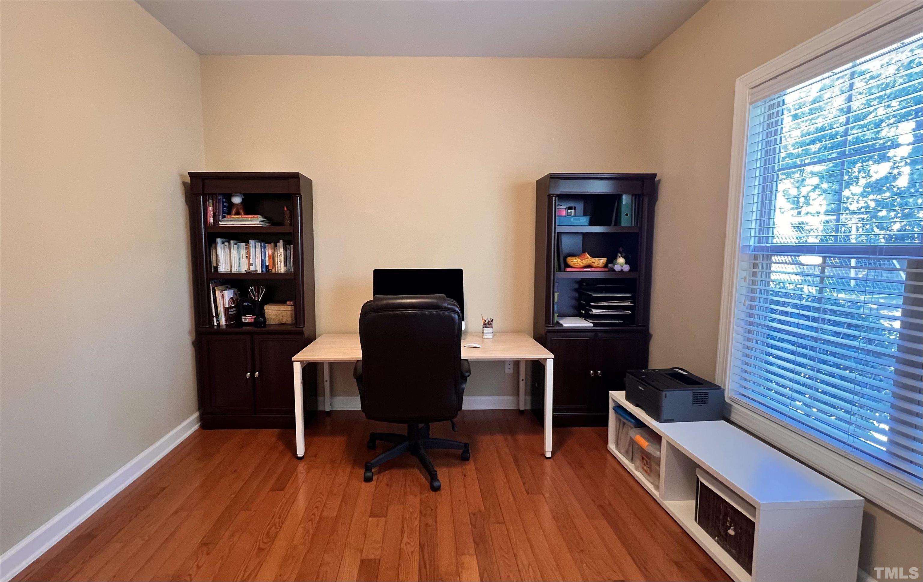 309 Parish House Road Cary, NC 27513 - Photo 5 of 33 a view of a workspace with furniture and wooden floor