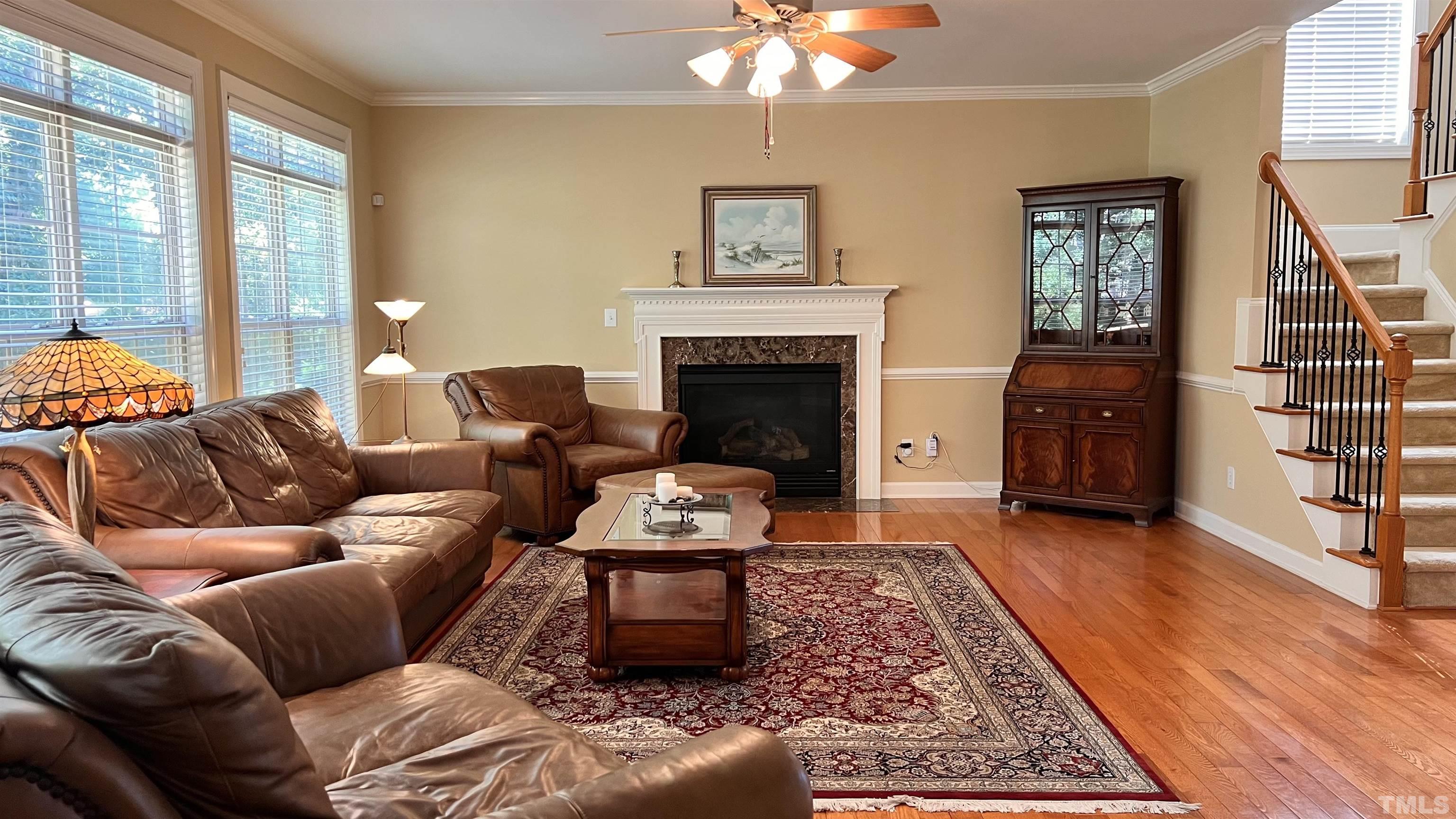 309 Parish House Road Cary, NC 27513 - Photo 6 of 33 a living room with furniture and a fireplace